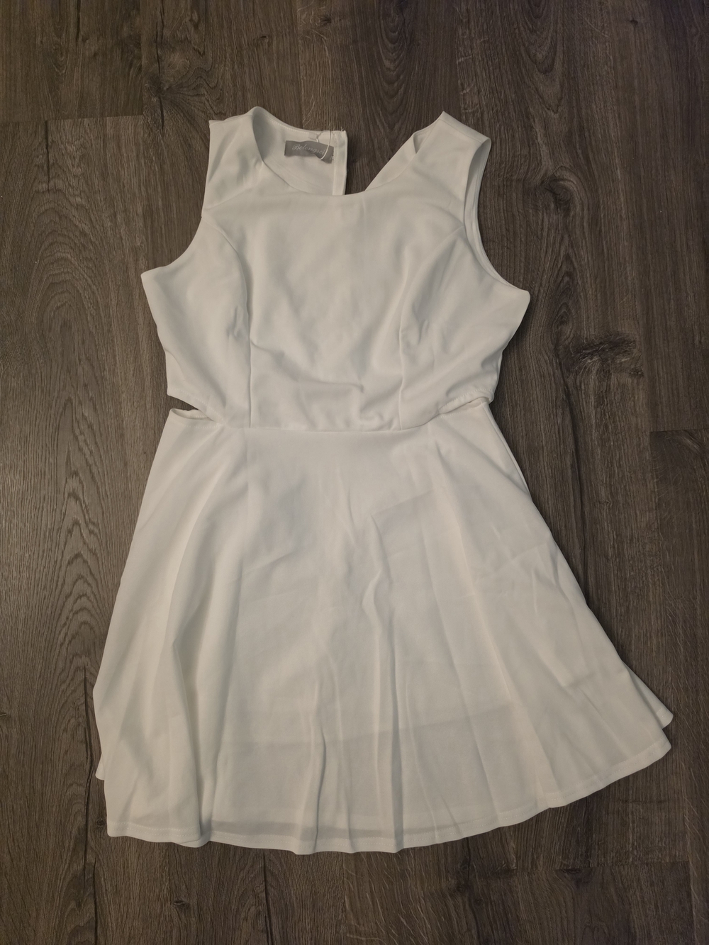 Elegant White Sleeveless Mini Dress with Cutout Waist